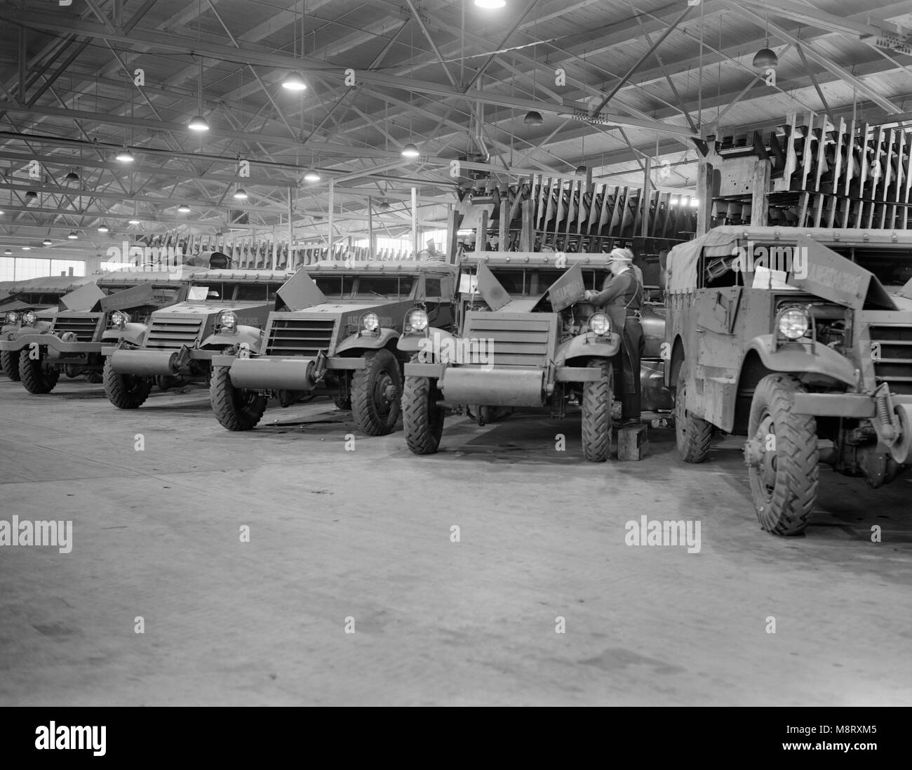 Army's Half-Track Scout Cars Ready for Delivery from Factory Converted to War Production, White Motor Company, Cleveland, Ohio, USA, Alfred T. Palmer for Office of War Information, December 1941 Stock Photo
