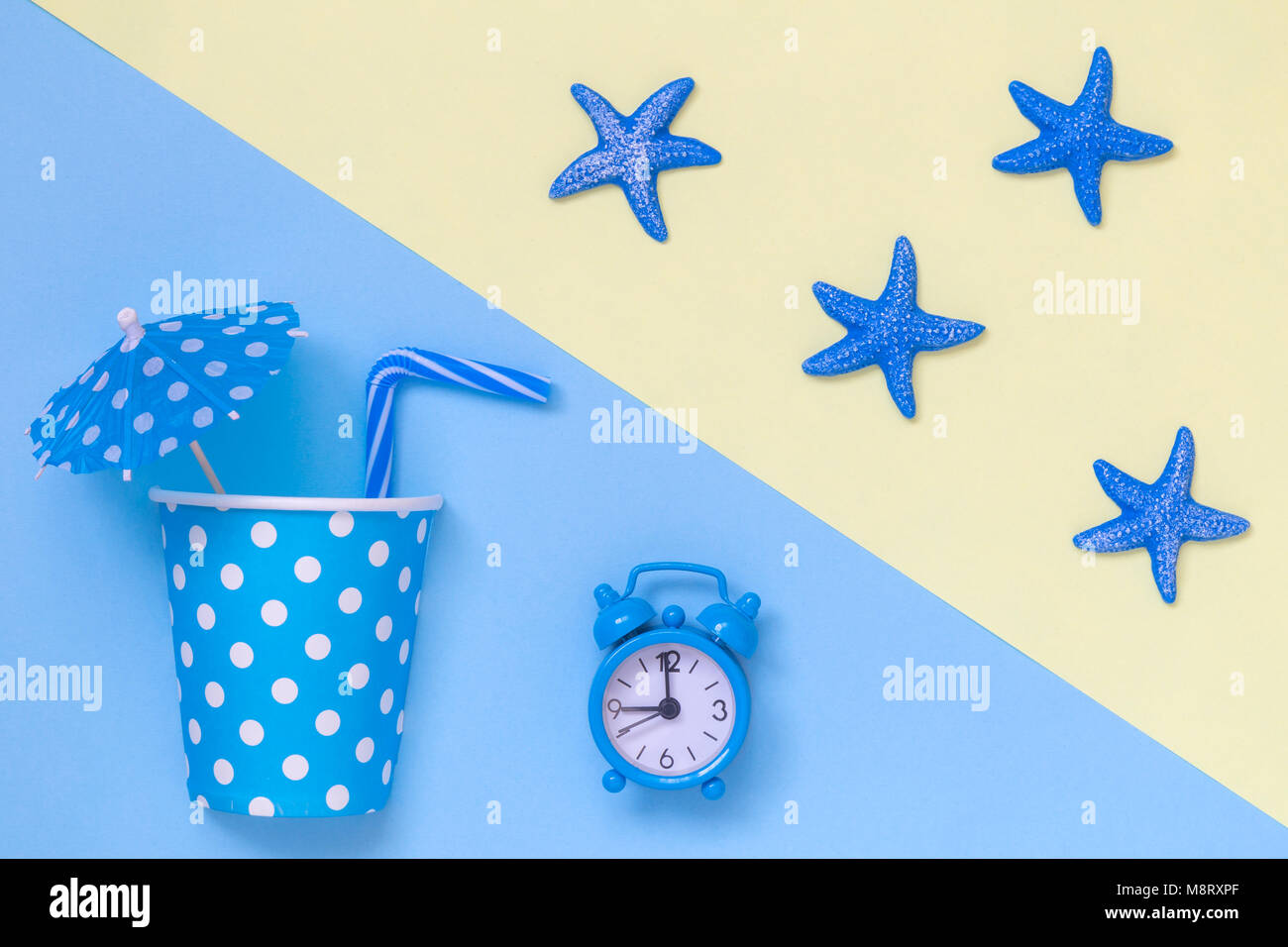 Paper polka design cup with cocktail parasol and drinking straw with ...