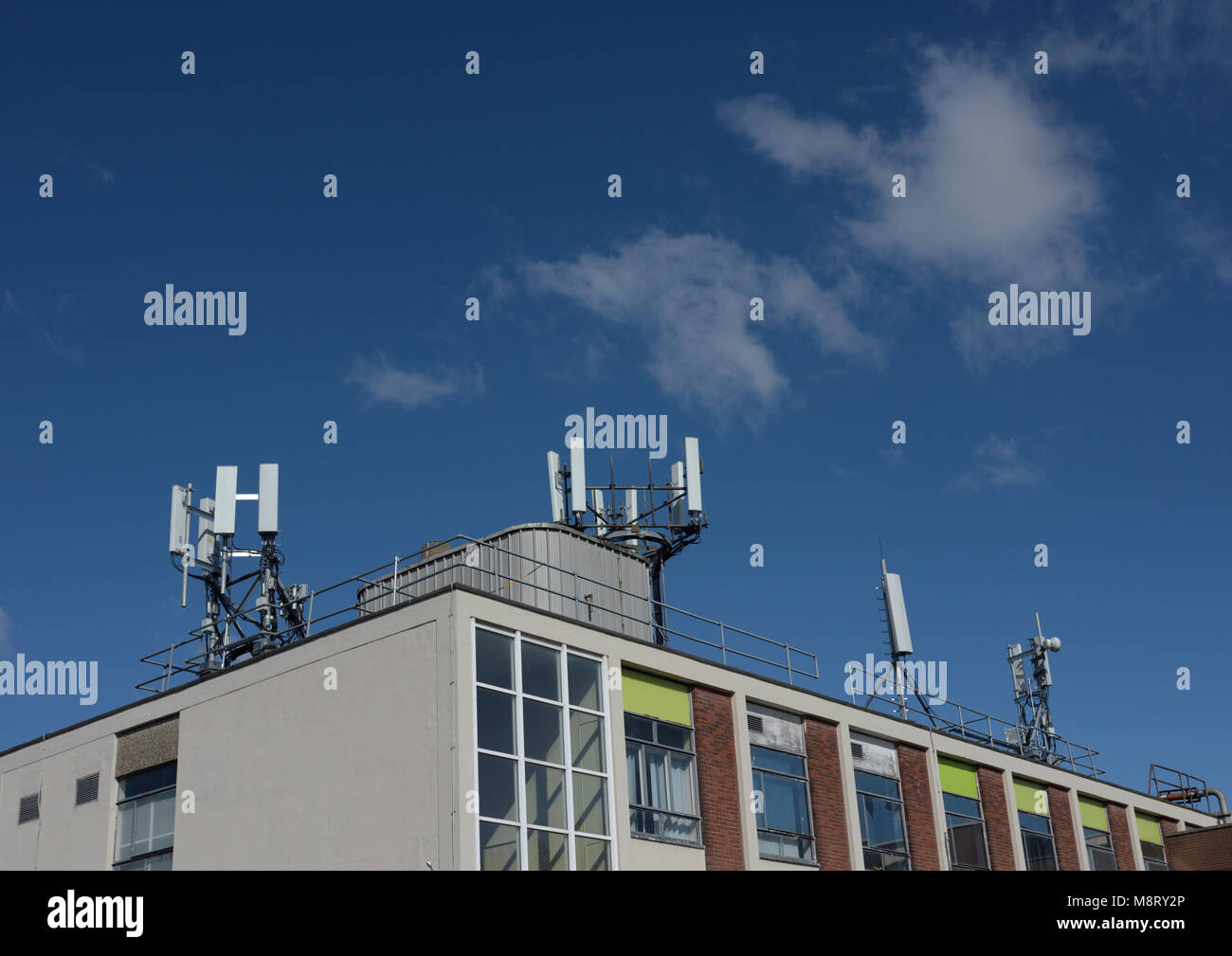 Mobile phone base stations mounted on building roof in bury lancashire