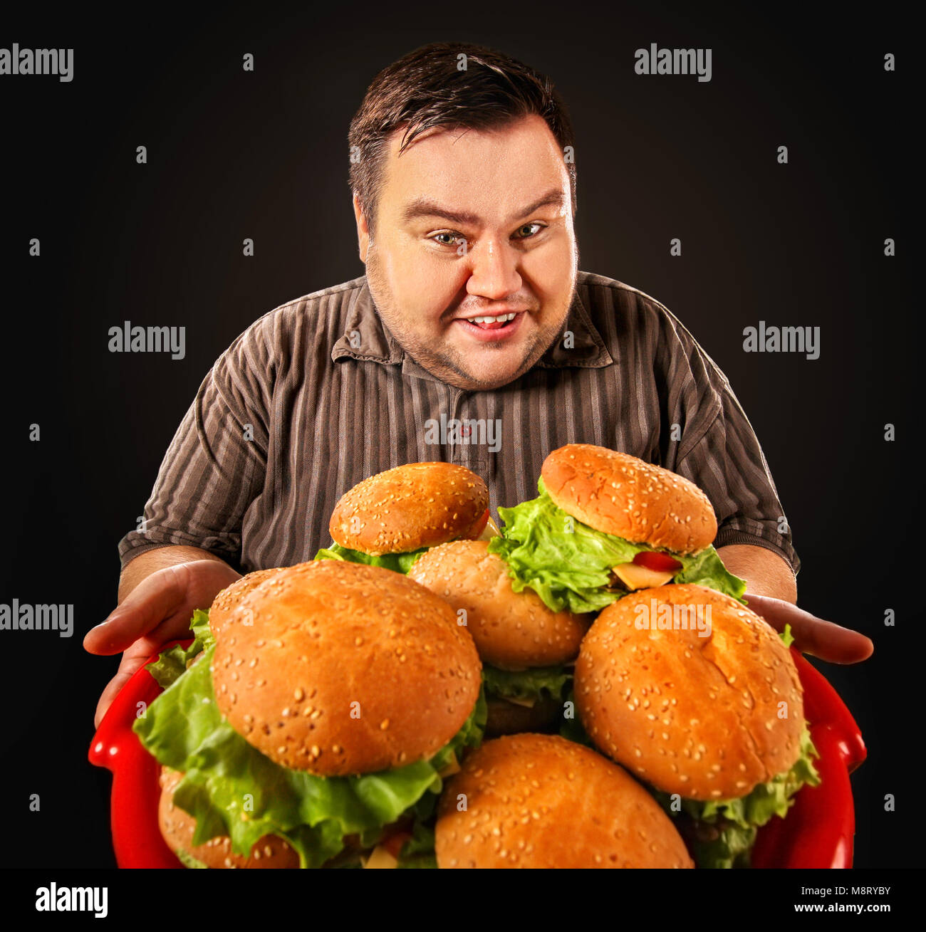Man Eating Fast Food Fat Person Made Great Huge Hamburger And Admires ...