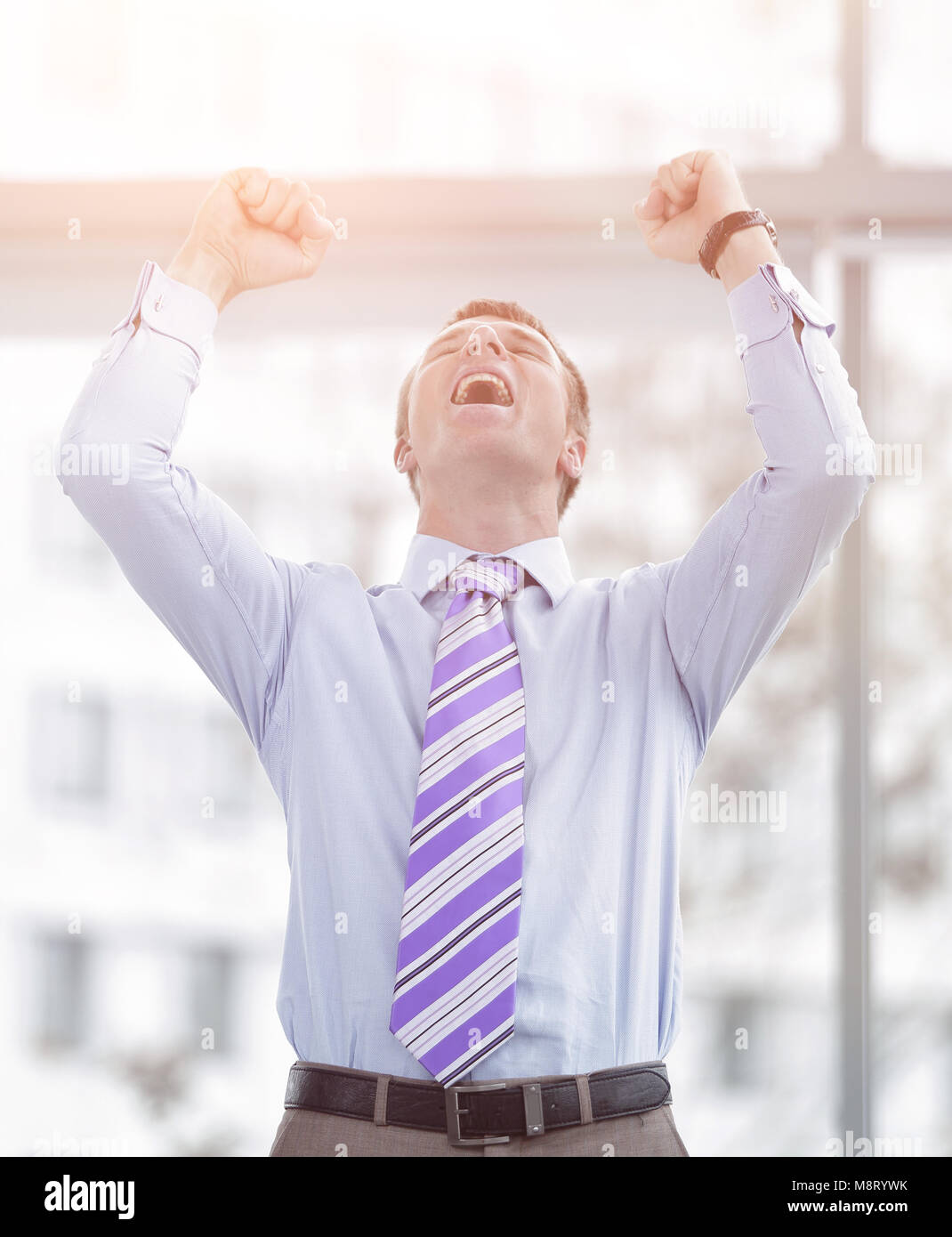 Businessman celebrating with his fists raised in the air Stock Photo ...