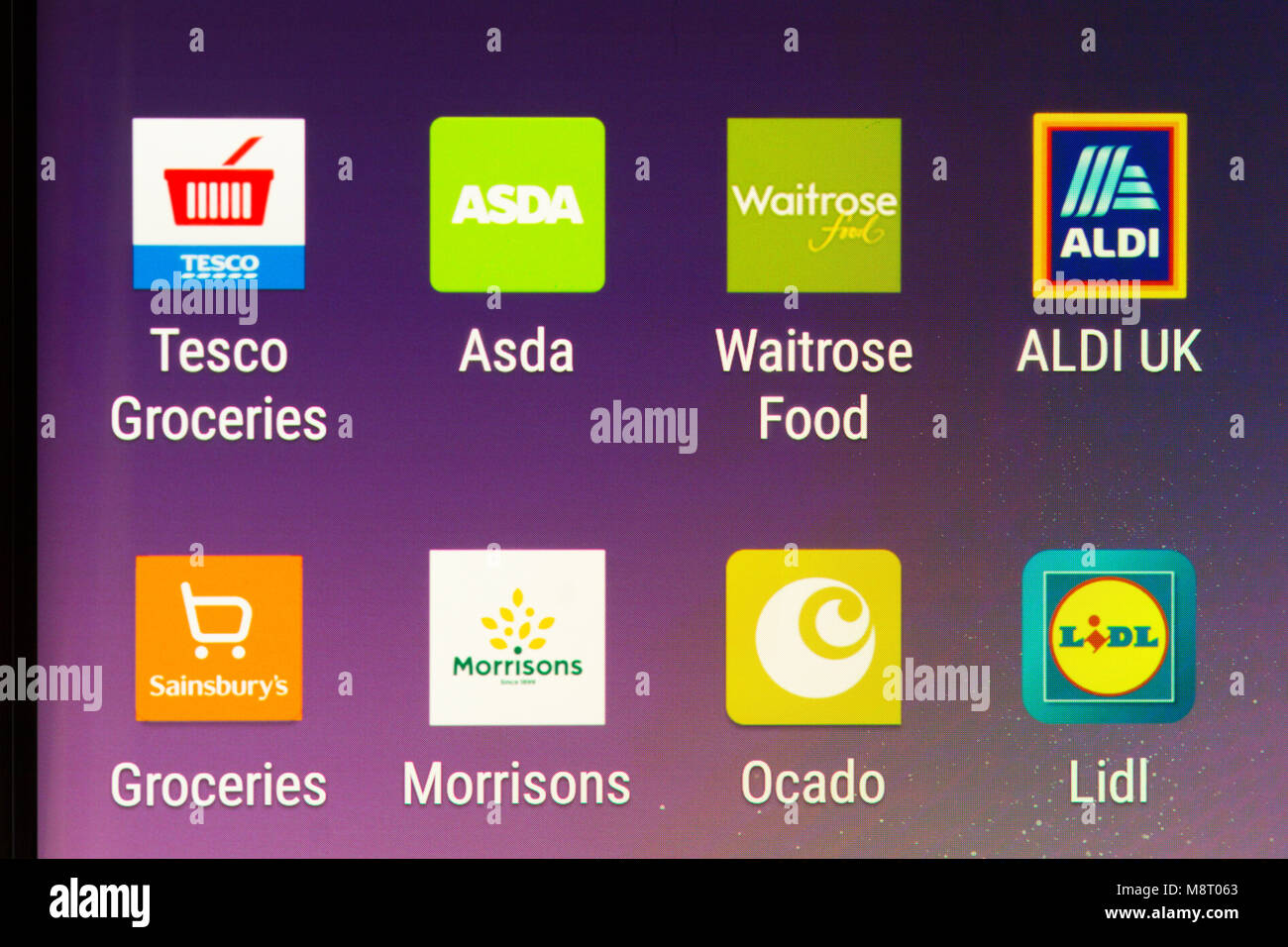 Apps on a smartphone for Britain's 'Big Four' supermarkets (Tesco, Asda, Sainsbury's and Morrisons), and the German discounters (Aldi and Lidl) Stock Photo
