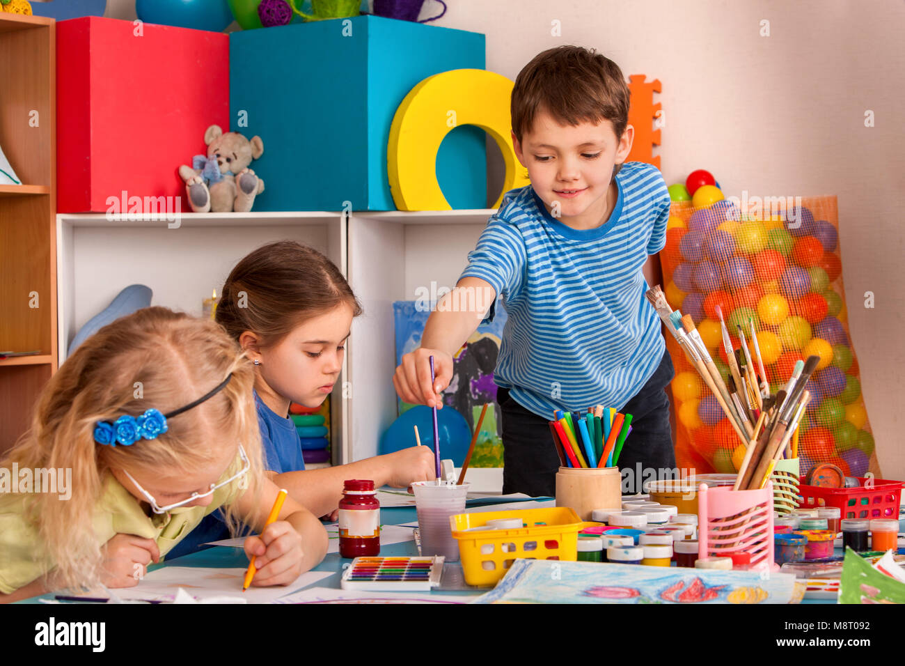 Small students girl painting in art school class Stock Photo - Alamy