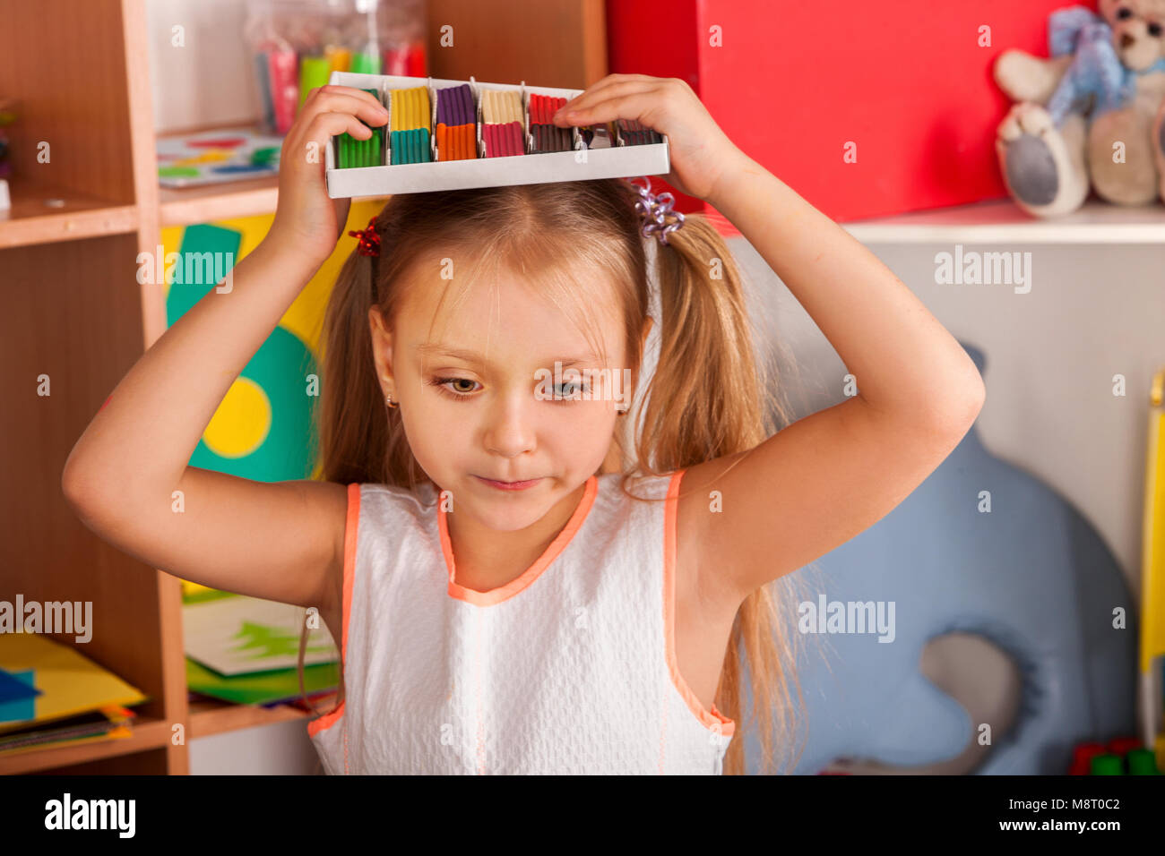 Plasticine modeling clay in children class. Teacher teaches in school