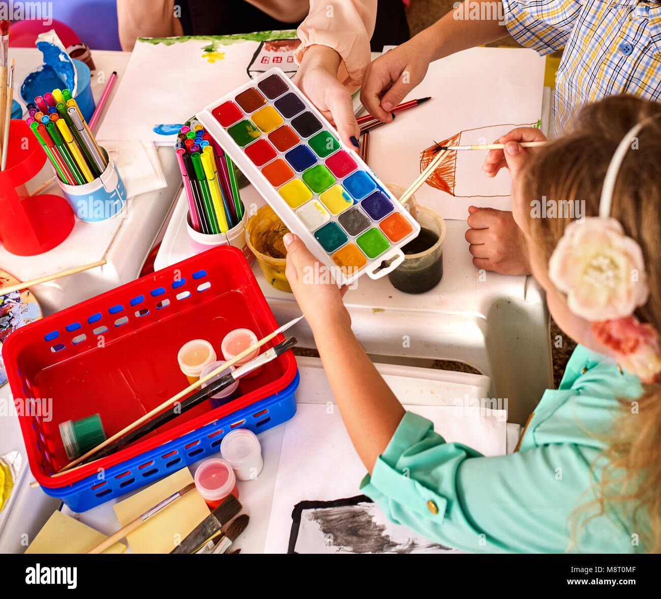 Small students girl and boy painting in art school class Stock Photo ...