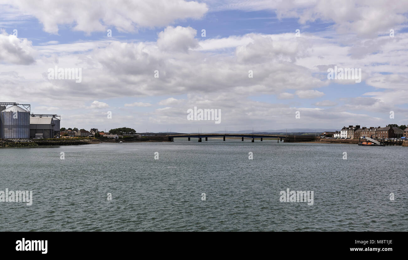 Looking from the centre of the River Esk in Montrose Port West towards the Montrose Basin, and the Road and Rail Bridges that cross the Esk. Stock Photo