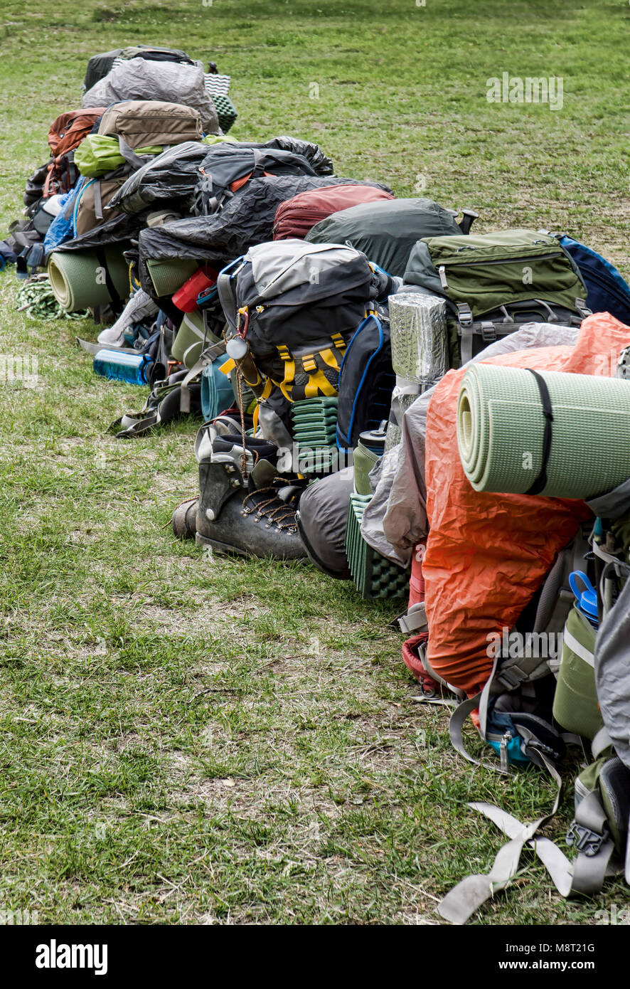 Row of backpacks and gear ready for a group hike on the Chilkoot Trail