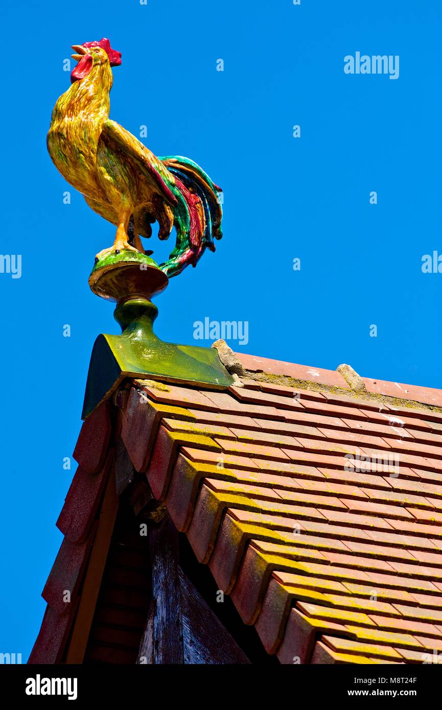 Cockerel shaped finial - Rooftop ornaments in Deauville, France, June 2017 Stock Photo