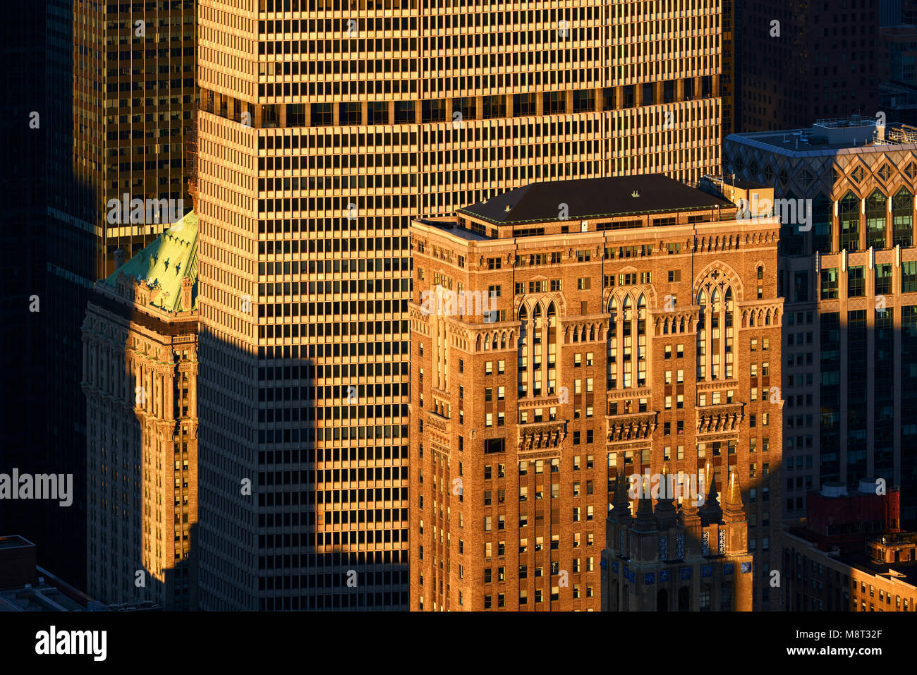 Aerial view at sunset of the Lincoln Building and the MetLife Building skyscrapers. Midtown Manhattan, New York City Stock Photo