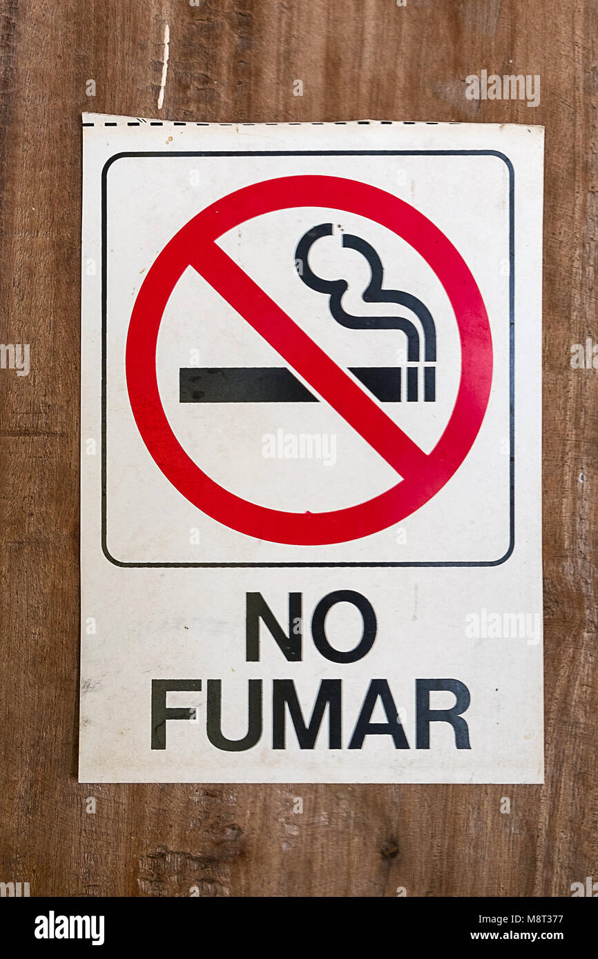 no smokin sign with spanish text 'no fumar' ( no smoking) Stock Photo