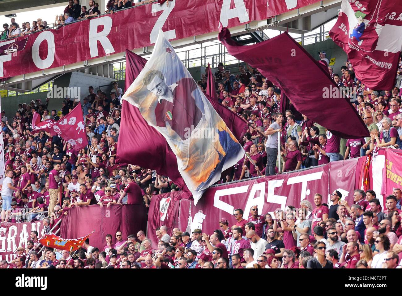 Turin Italy May 25 2017 Supporters of Torino FC celebrating  the rebuild of glorious Filadelfia stadium flag with effigy of beloved ancient captain Stock Photo