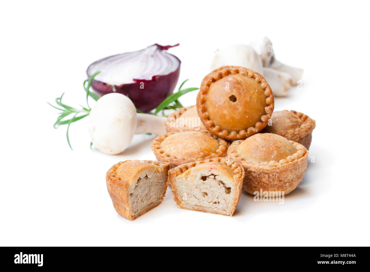Group of mini pies with mushroom and onion isolated on white Stock