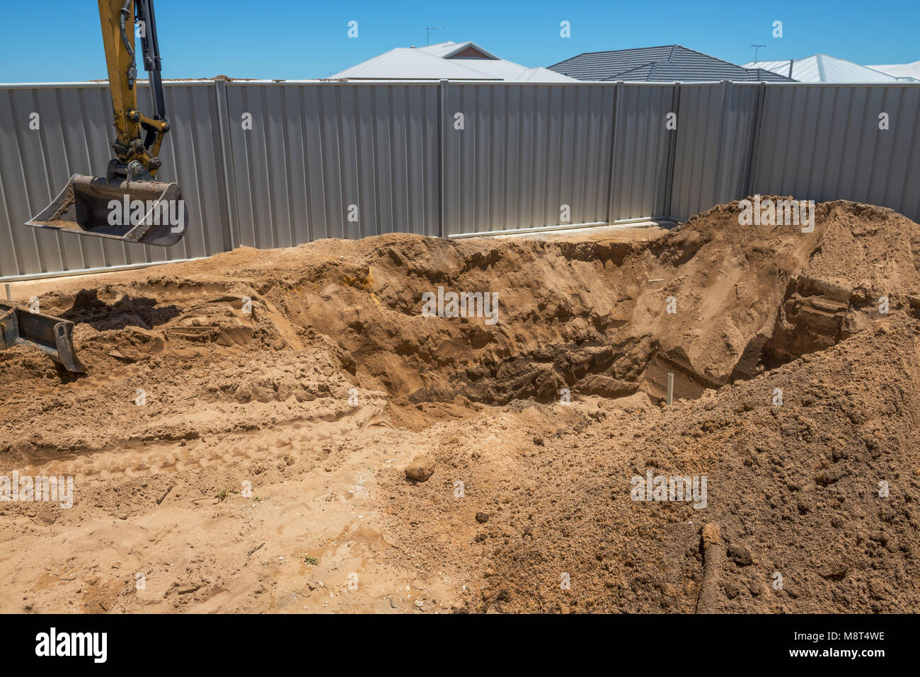 Excavation works for the installation of a swimming pool.Swimming pool under construction. Stock Photo