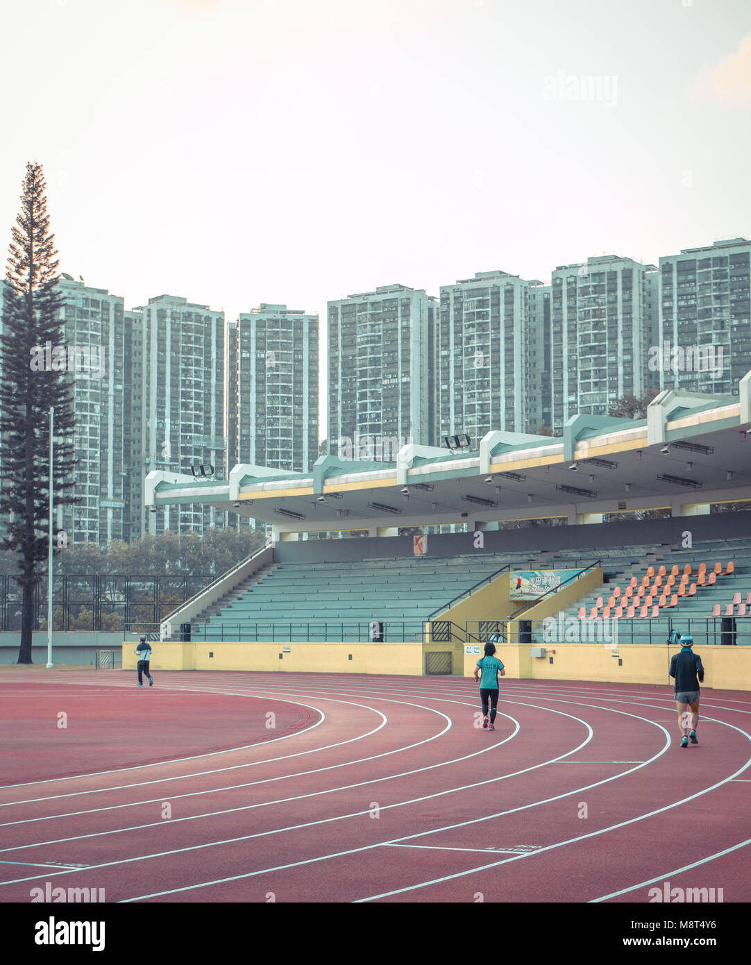 Runners in the Shatin sport ground in morning Stock Photo