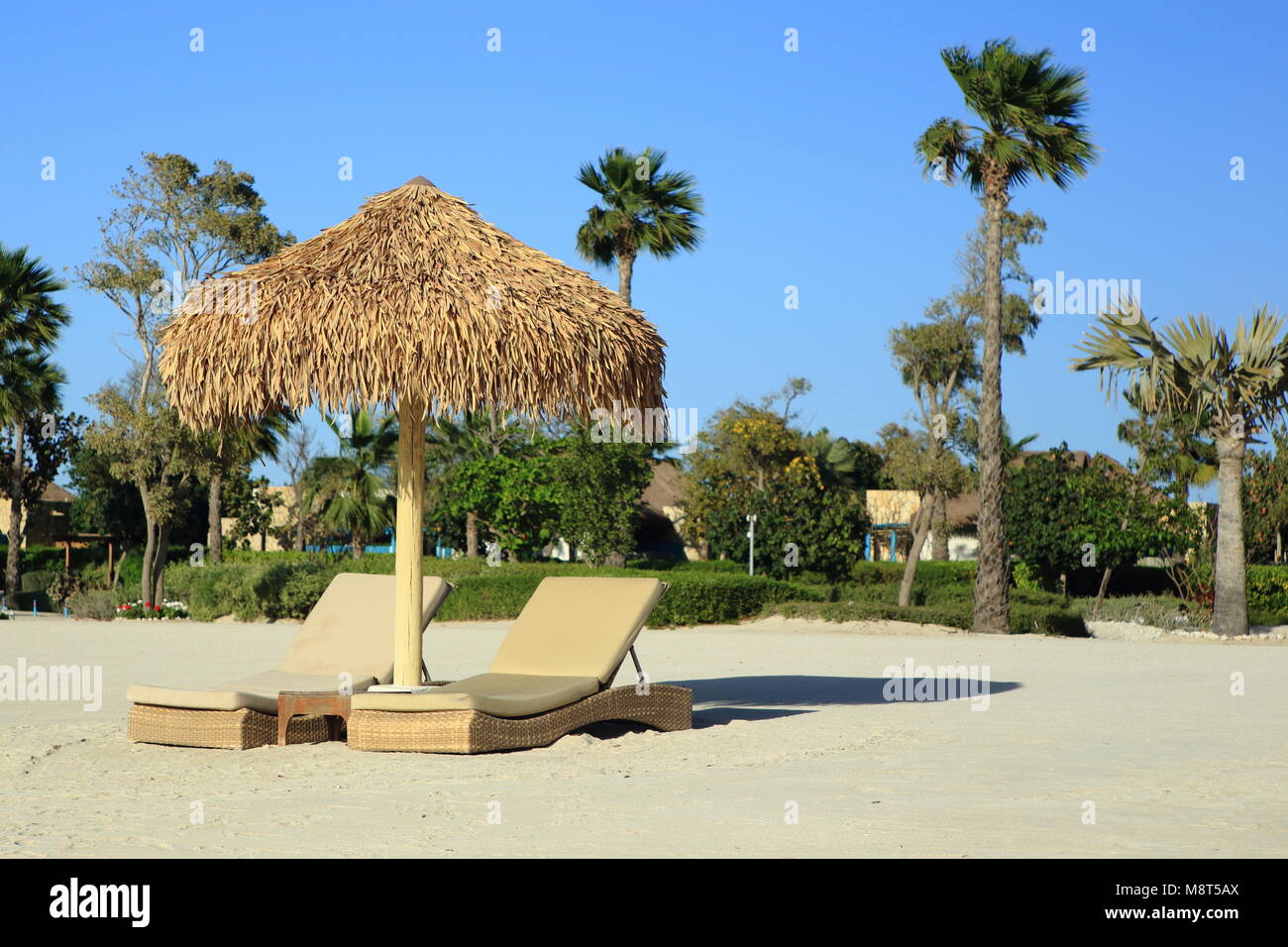 DOHA, Qatar March 14, 2018 Beach chairs and umbrellas waiting for