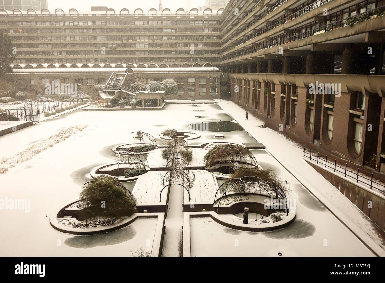 LONDON, UK -28th Feb 2017: Heavy snow falls a crossed the Barbican lake caused by snow storm Emma. Stock Photo