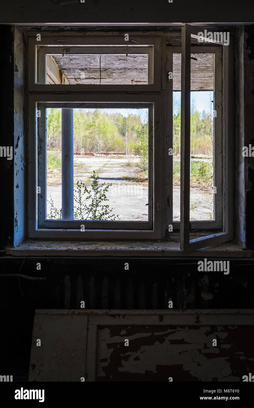 Broken window in abandoned building Stock Photo