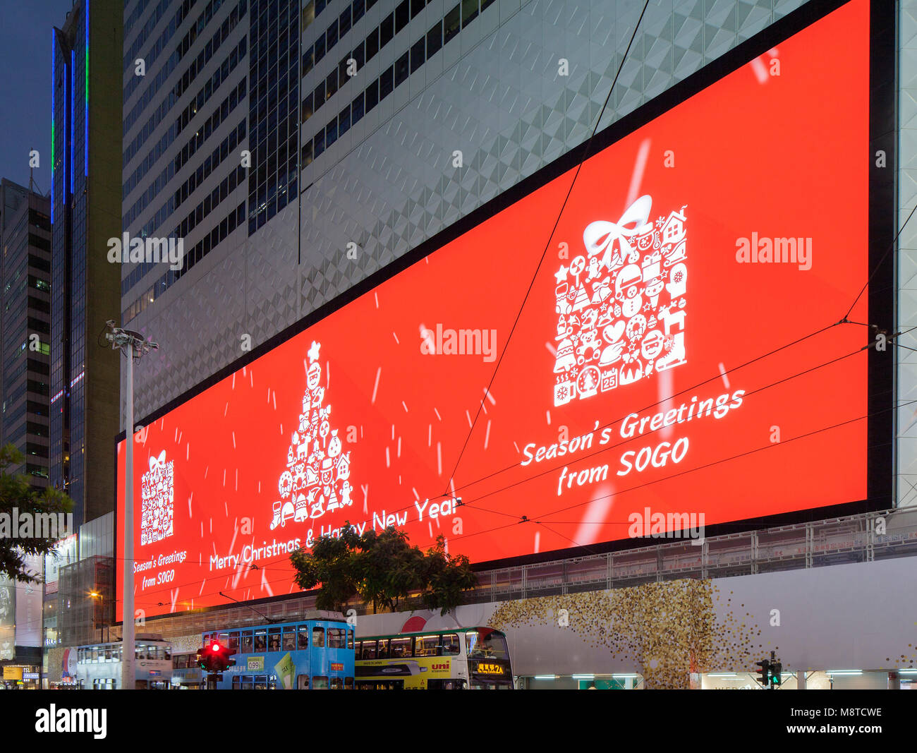Screen displaying Christmas greetings. Sogo Mall, Hong Kong, Hong Kong. Architect: Mitsubishi Electric, 2017. Stock Photo