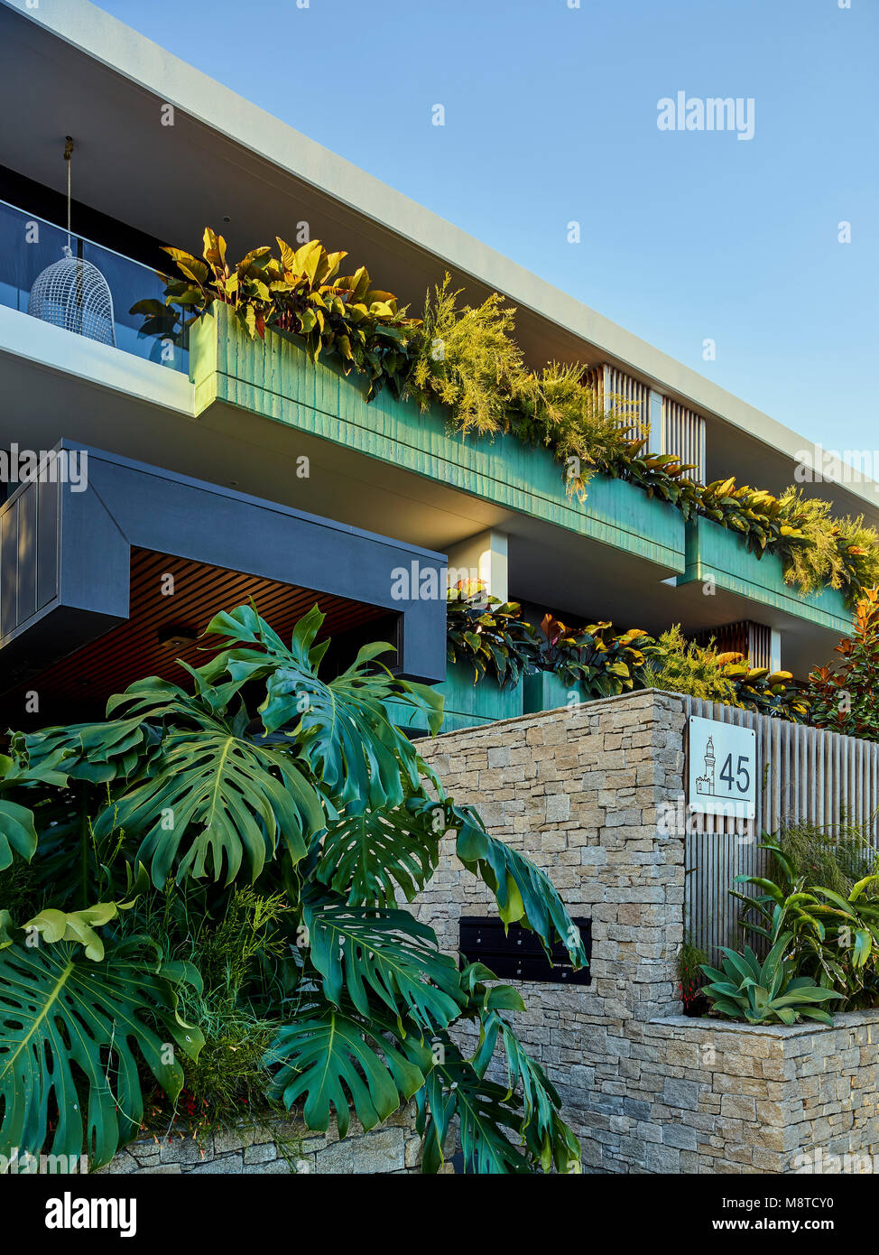 Street facade detail showing entry and balcony planter boxes. Lawson Apartments, Byron Bay