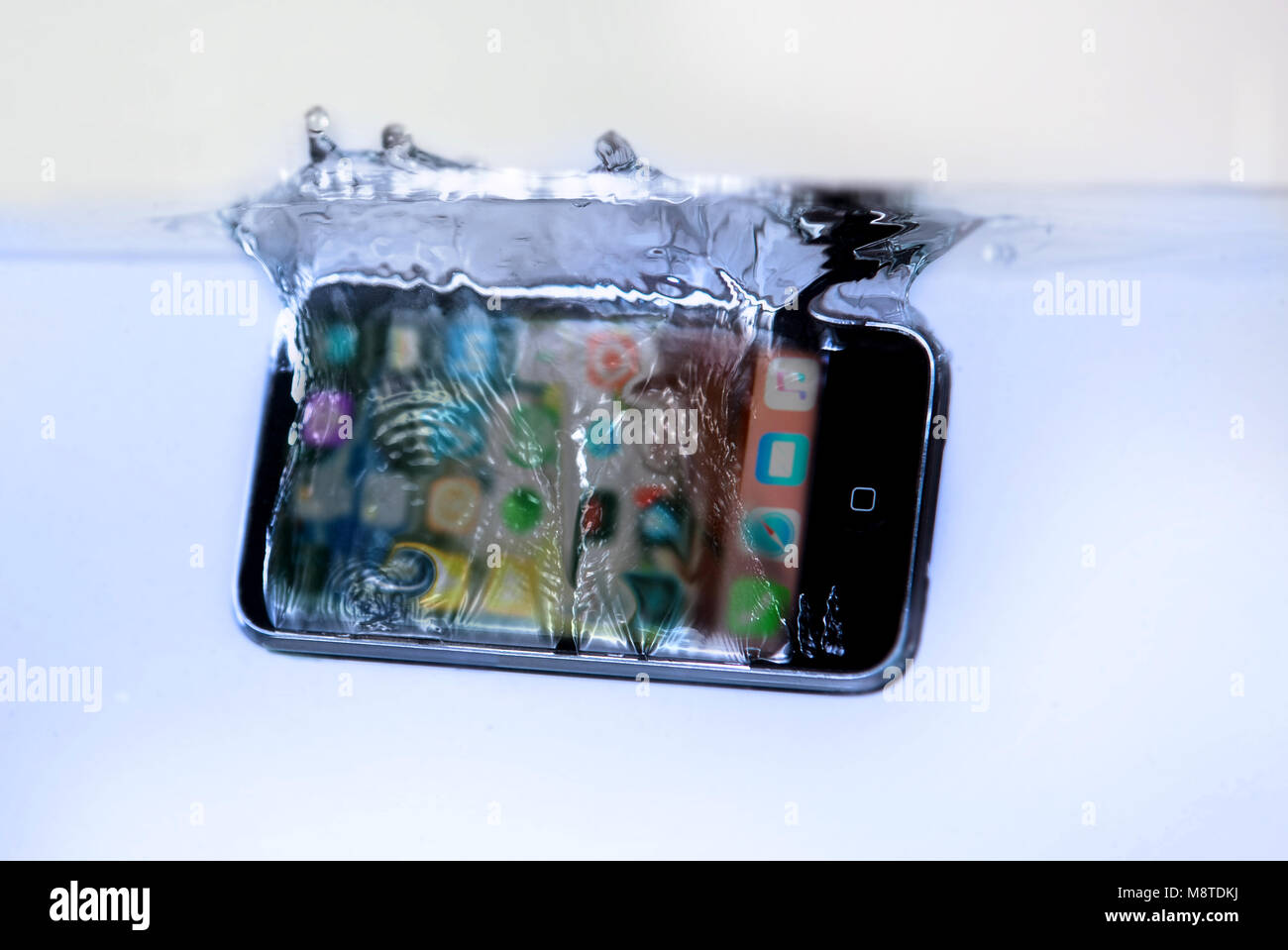 Montreal,Canada 19,March 2018. Smartphone dropped into water.Credit:Mario Beauregard/Alamy Live News Stock Photo