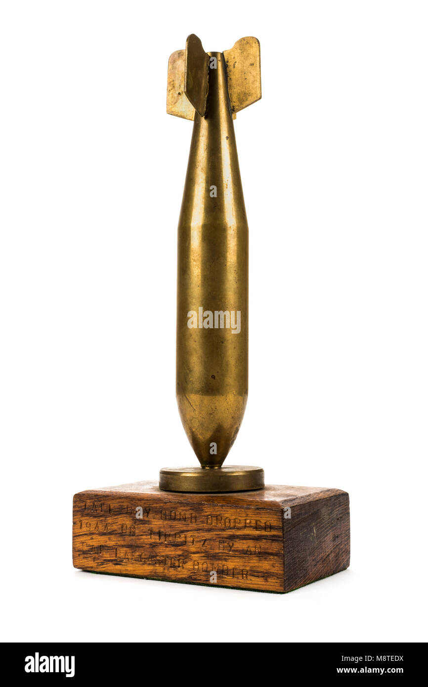 Brass replica of a WW2 'Tallboy' bomb with the inscription underneath 'Tallboy bomb dropped 1944 on Tirpitz by an RAF Lancaster bomber' Stock Photo