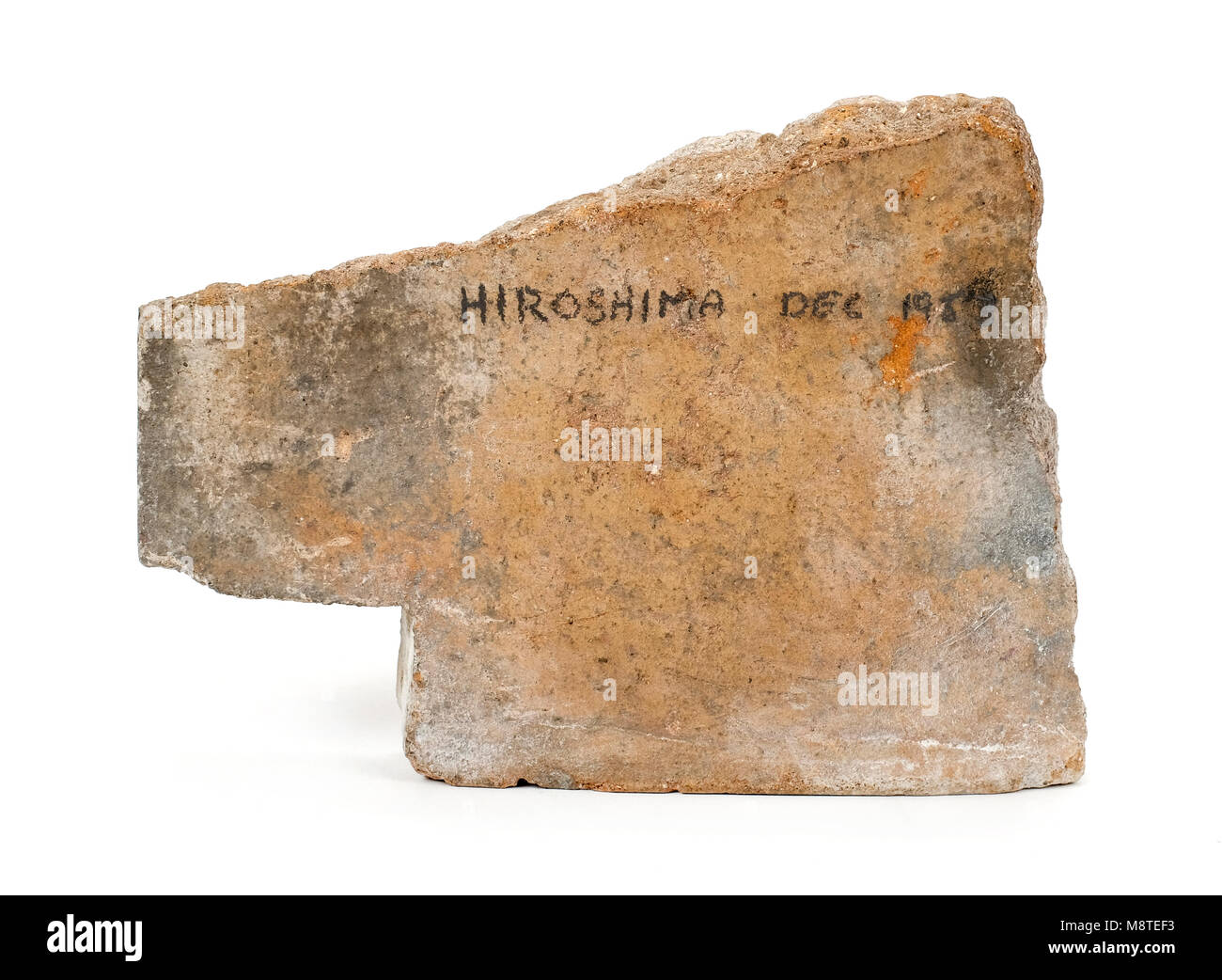 Roof tile from a building in Hiroshima, Japan, brought back in 1953, and showing a heat mark caused by the intense heat of the atomic bomb. Stock Photo