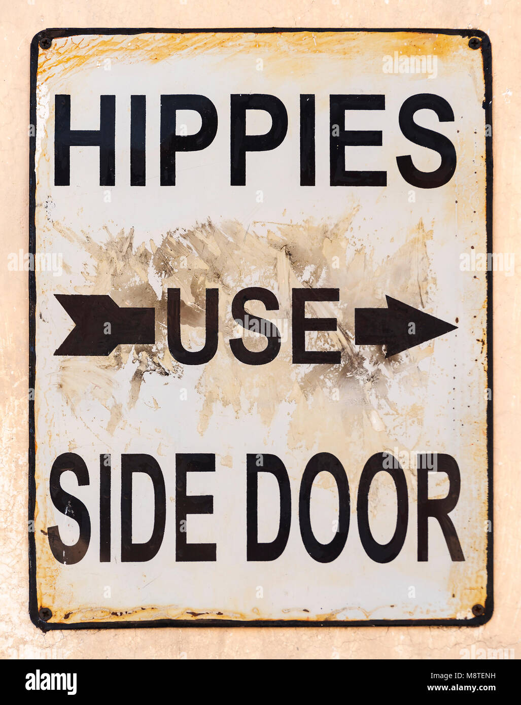 Hippies use side door sign with arrow Stock Photo Alamy