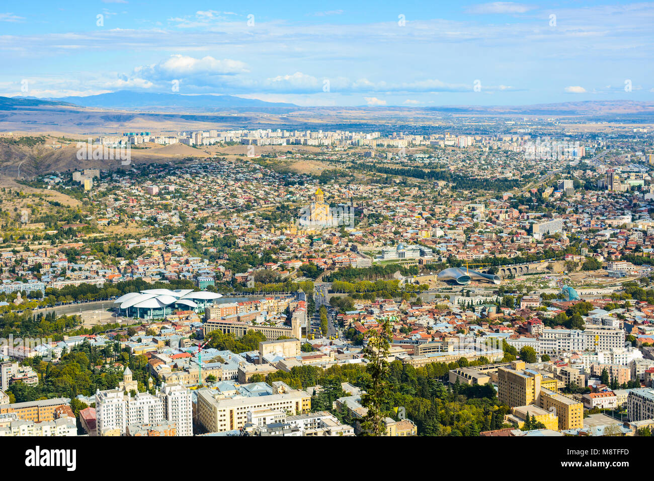 Panorama of Tbilisi (residential areas, the old churches, new creative buildings). Stock Photo
