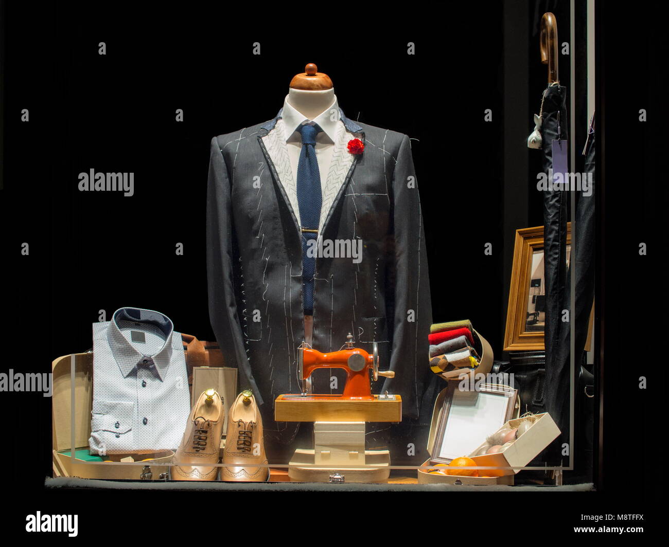 New elegant jacket stitching in tailor's showcase Stock Photo Alamy