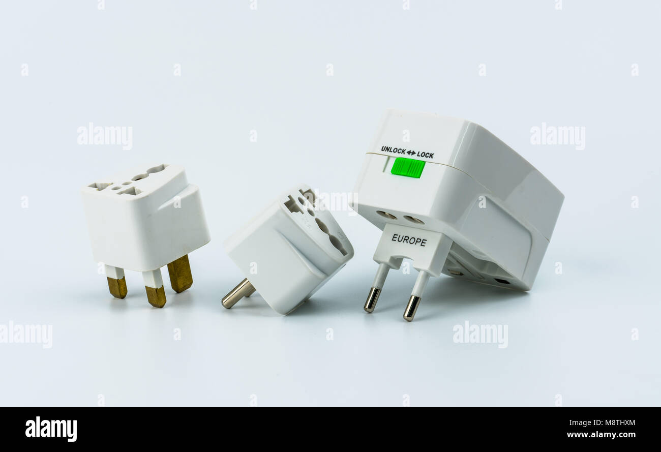 Set of universal plug adapters for travel around the world isolated on white background Stock