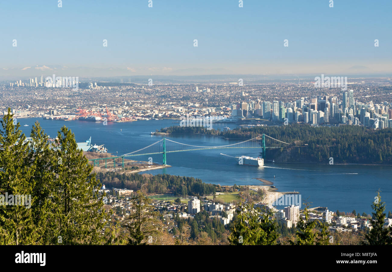 Aerial view of Stanley Park, Vancouver downtown and Greater Vancouver from the Cypress Mountain Lookout.  Layer of smog over the city. Stock Photo