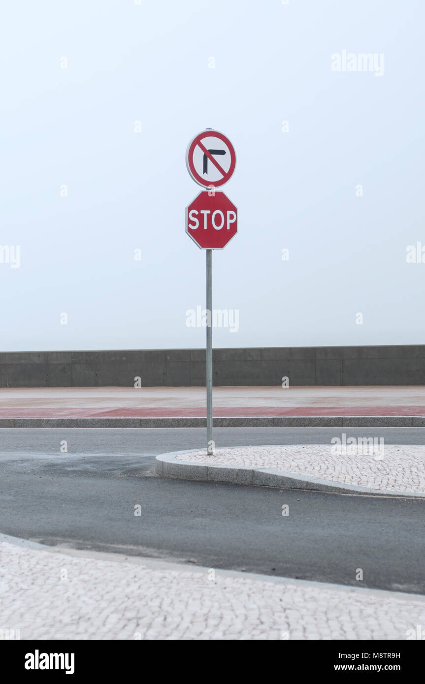 road signs on a promenade at the atlantic shore in Portugal Stock Photo