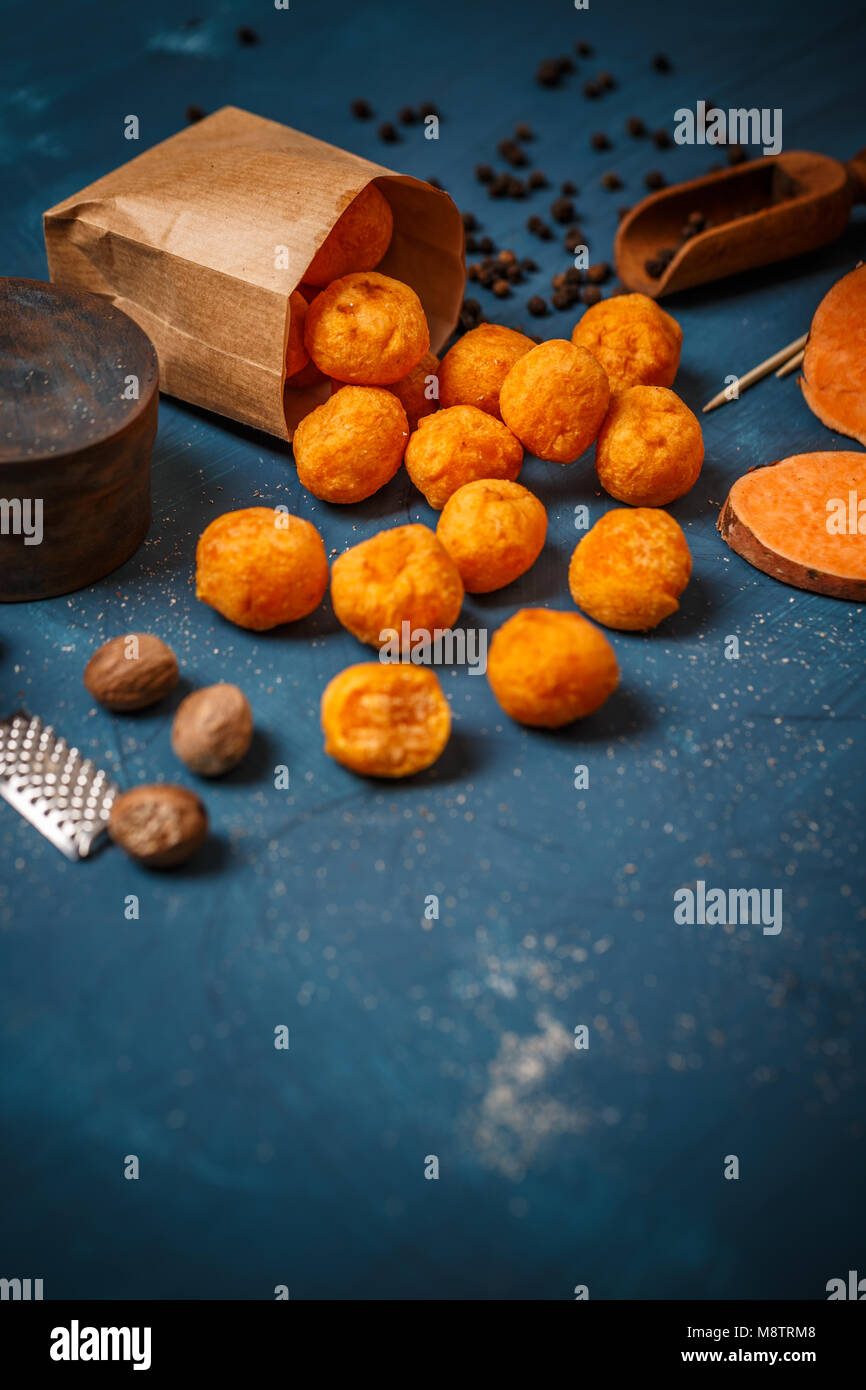 Sweet potato croquettes on blue background, space for your text Stock Photo