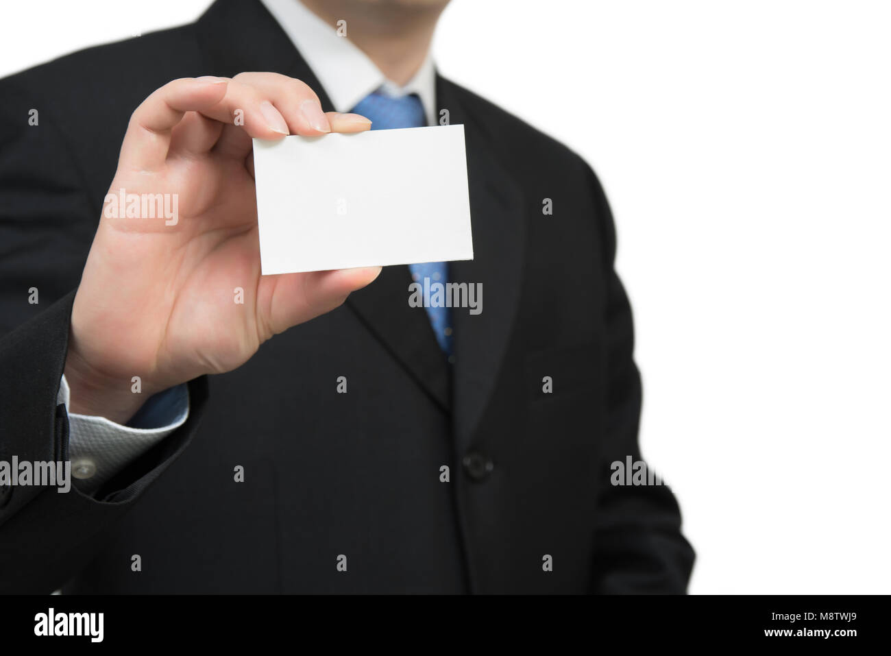 Man's hand showing business card - closeup shot on white background. Stock Photo