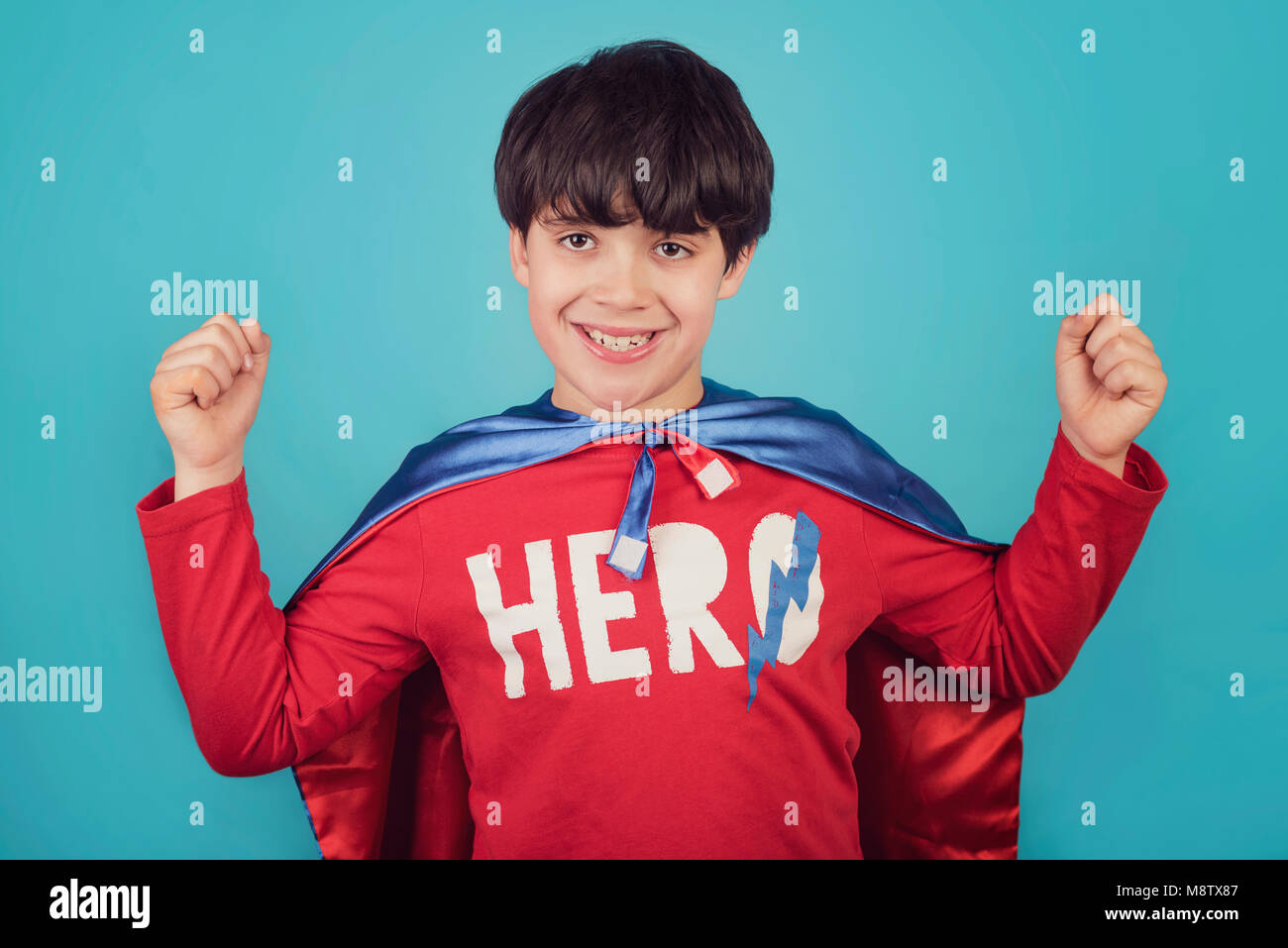 Happy little child playing superhero Stock Photo