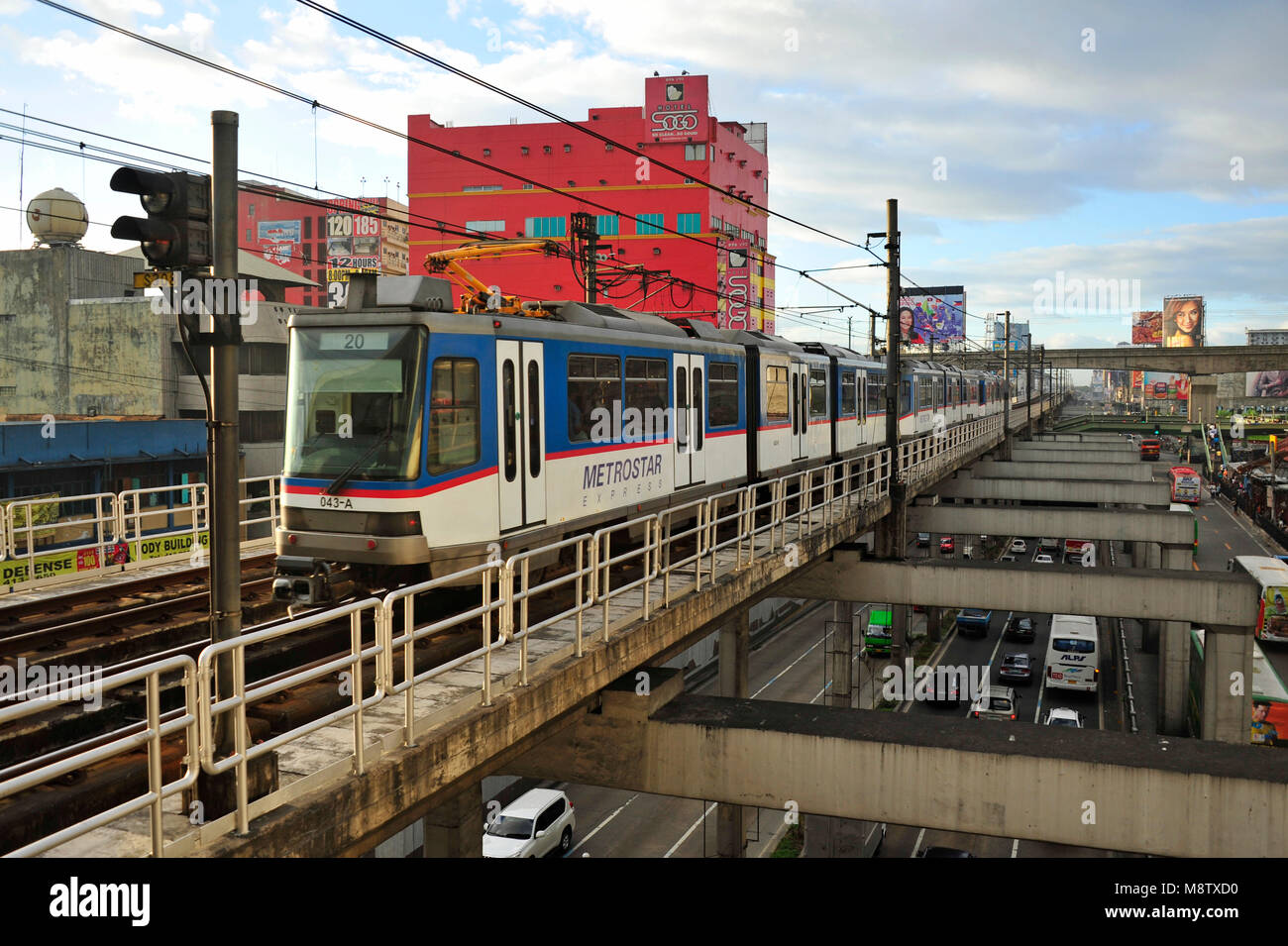 A metro train departs from a station in Metro Manila, Philippines Stock