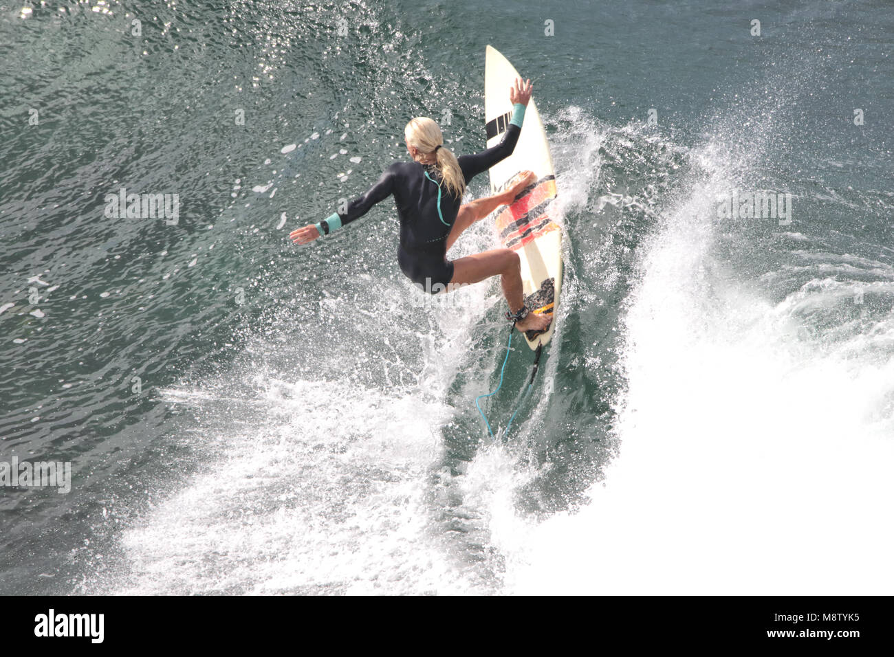 Pro surfer, Eveline Hooft, prepping at Honolua Bay on Maui. Stock Photo
