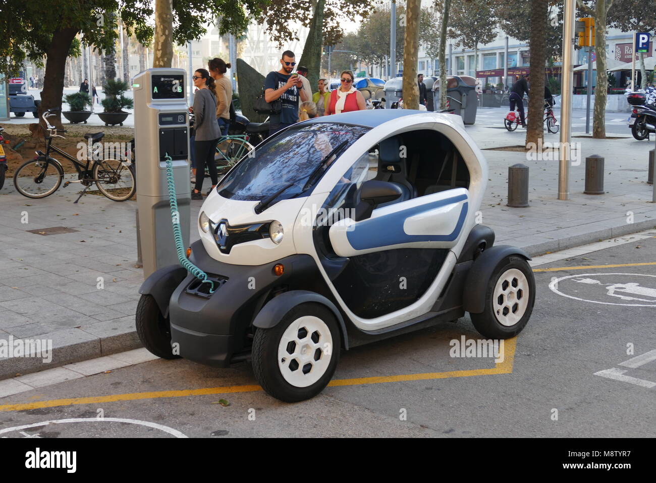 Electric car charging at station in Barcelona Spain November 2015