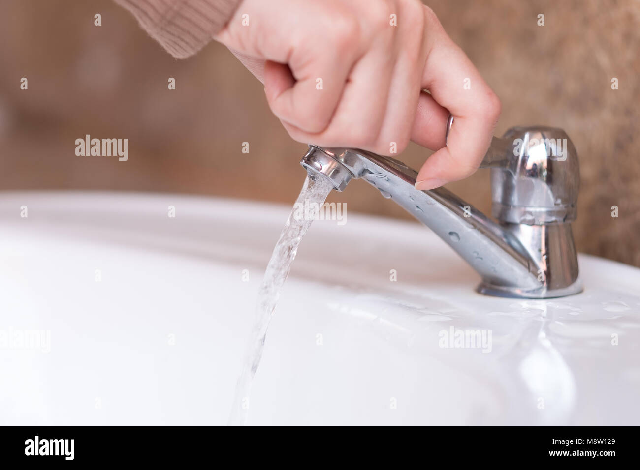 Close up hand open or close water tab . faucet and saving concept Stock  Photo - Alamy