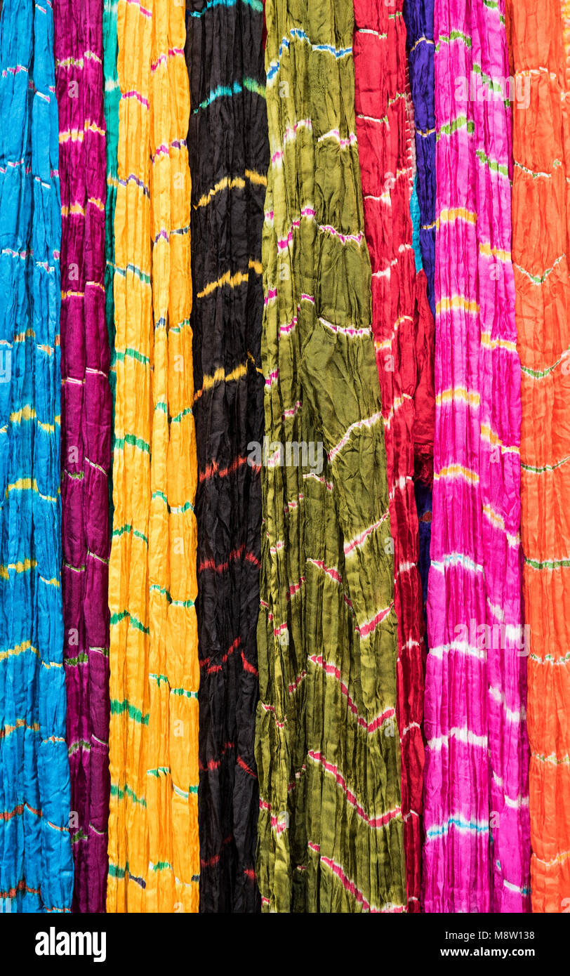 Colorful Indian Sarees (lehriya) hanging at shop in Nathdwara Rajasthan India Stock Photo