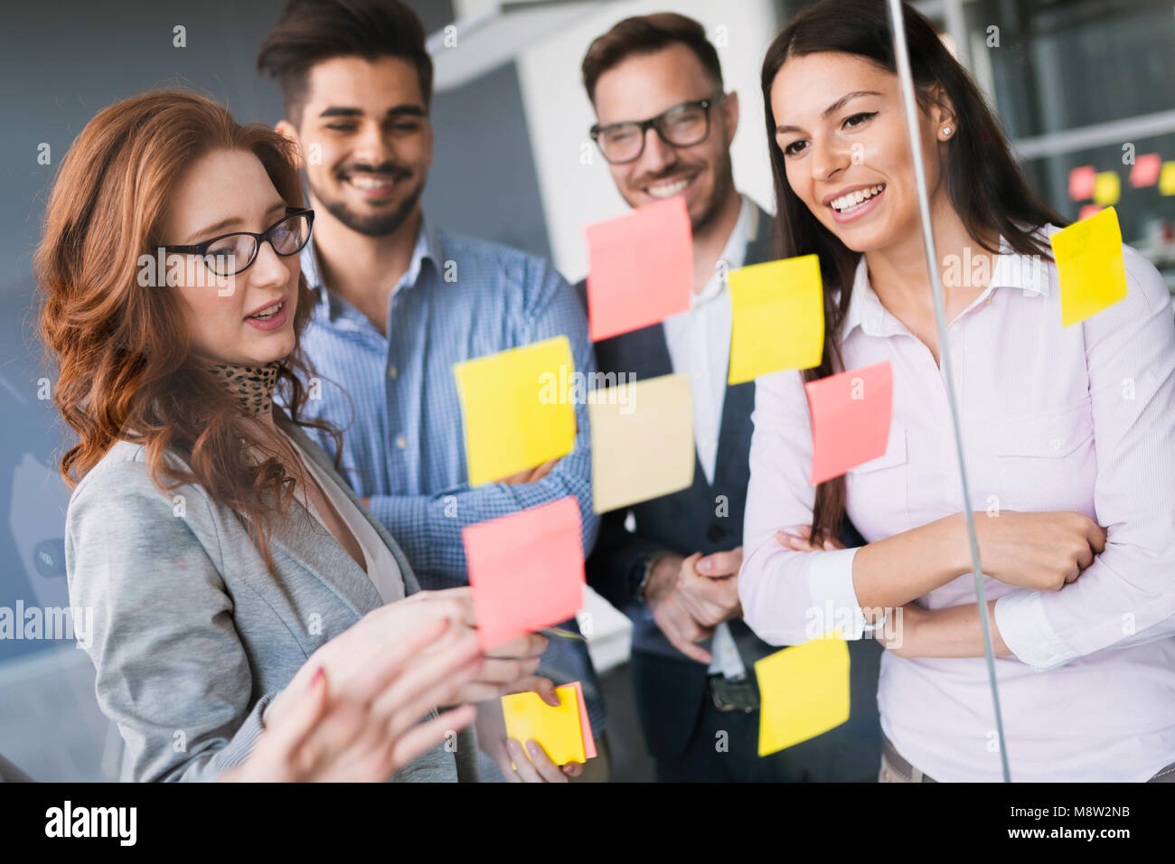 Group of business people collaborating in office Stock Photo - Alamy
