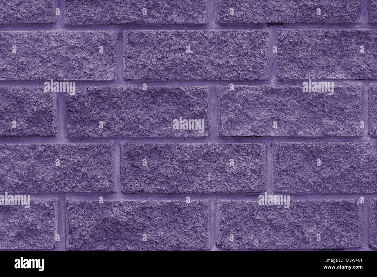 Stone wall of the rectangular bricks - close up (photo is toned in ...