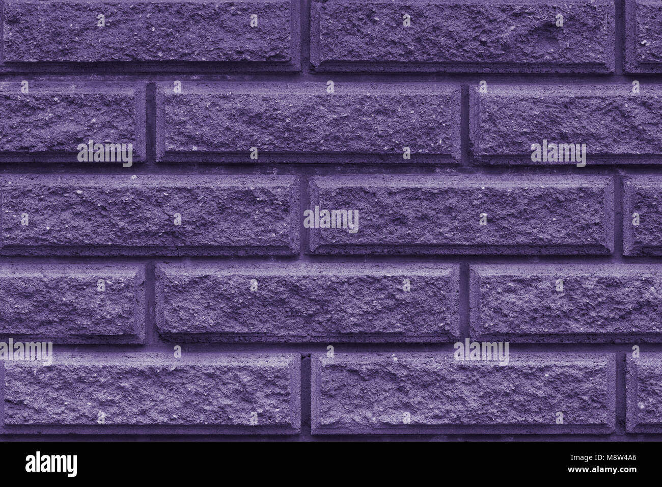 Stone wall of the rectangular bricks - close up (photo is toned in ...