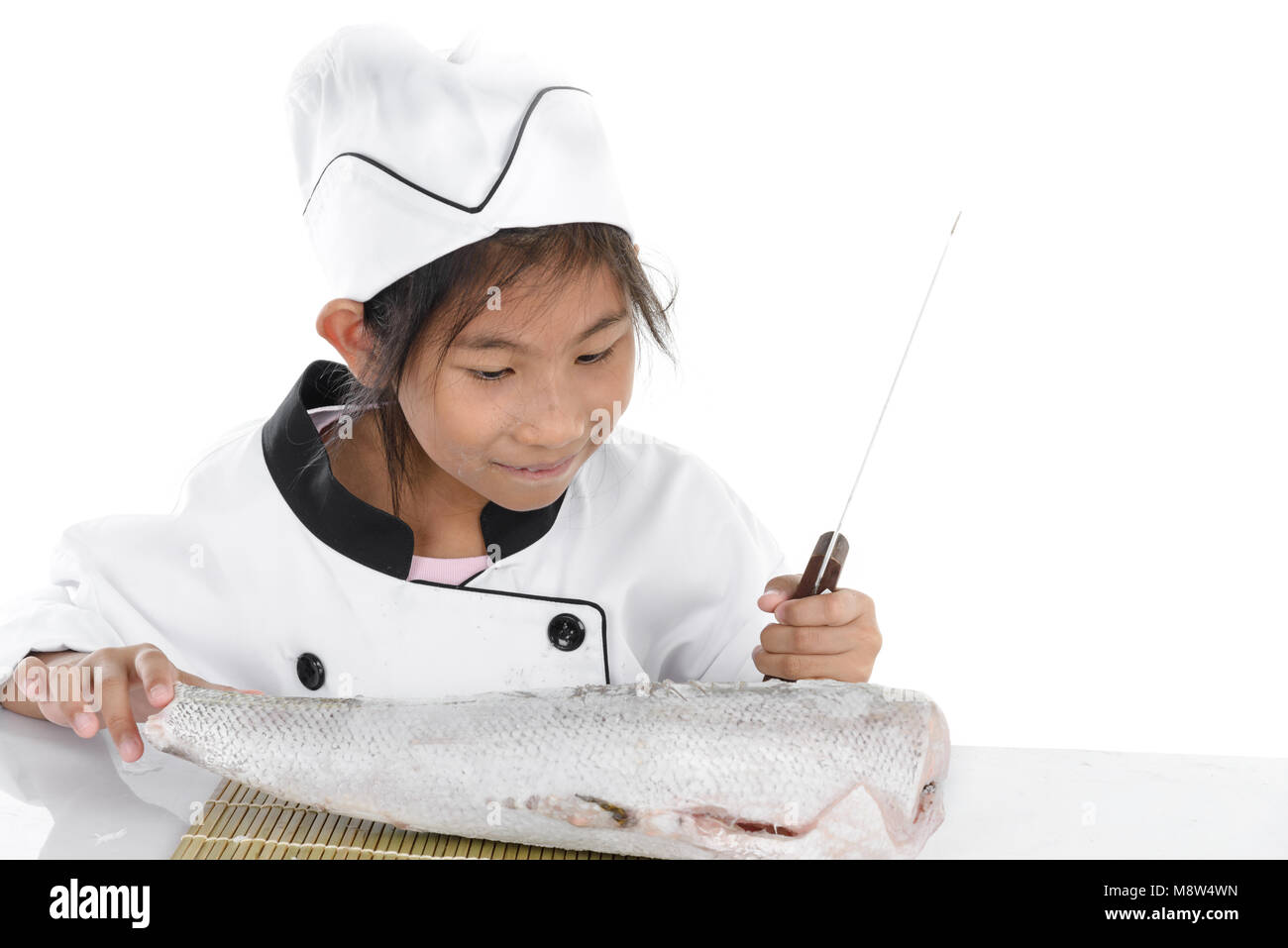 Uniform Japanese chef looking big freezing fish on white background. Stock Photo