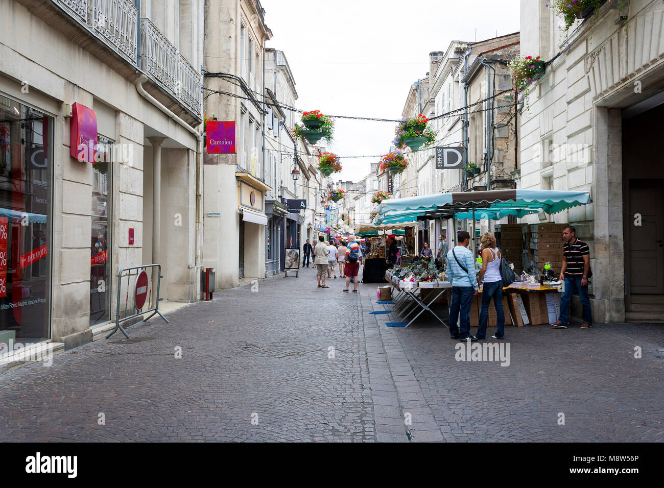 Cognac, Charente, France - July 9, 2011: People shopping at market stalls along Rue d'Angouleme in Cognac France Stock Photo