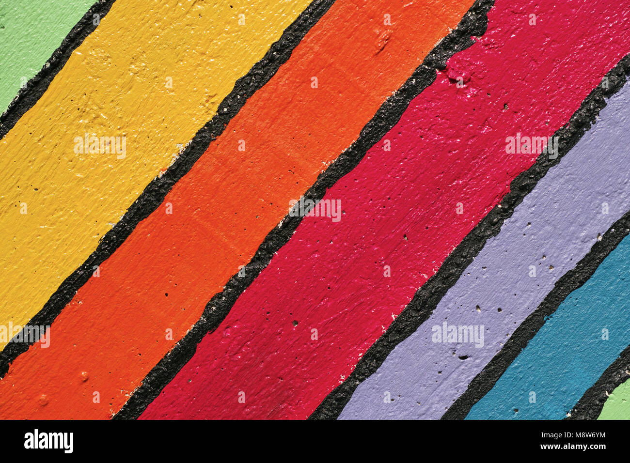 multicolor stripes painted on a wall with bright colors Stock Photo