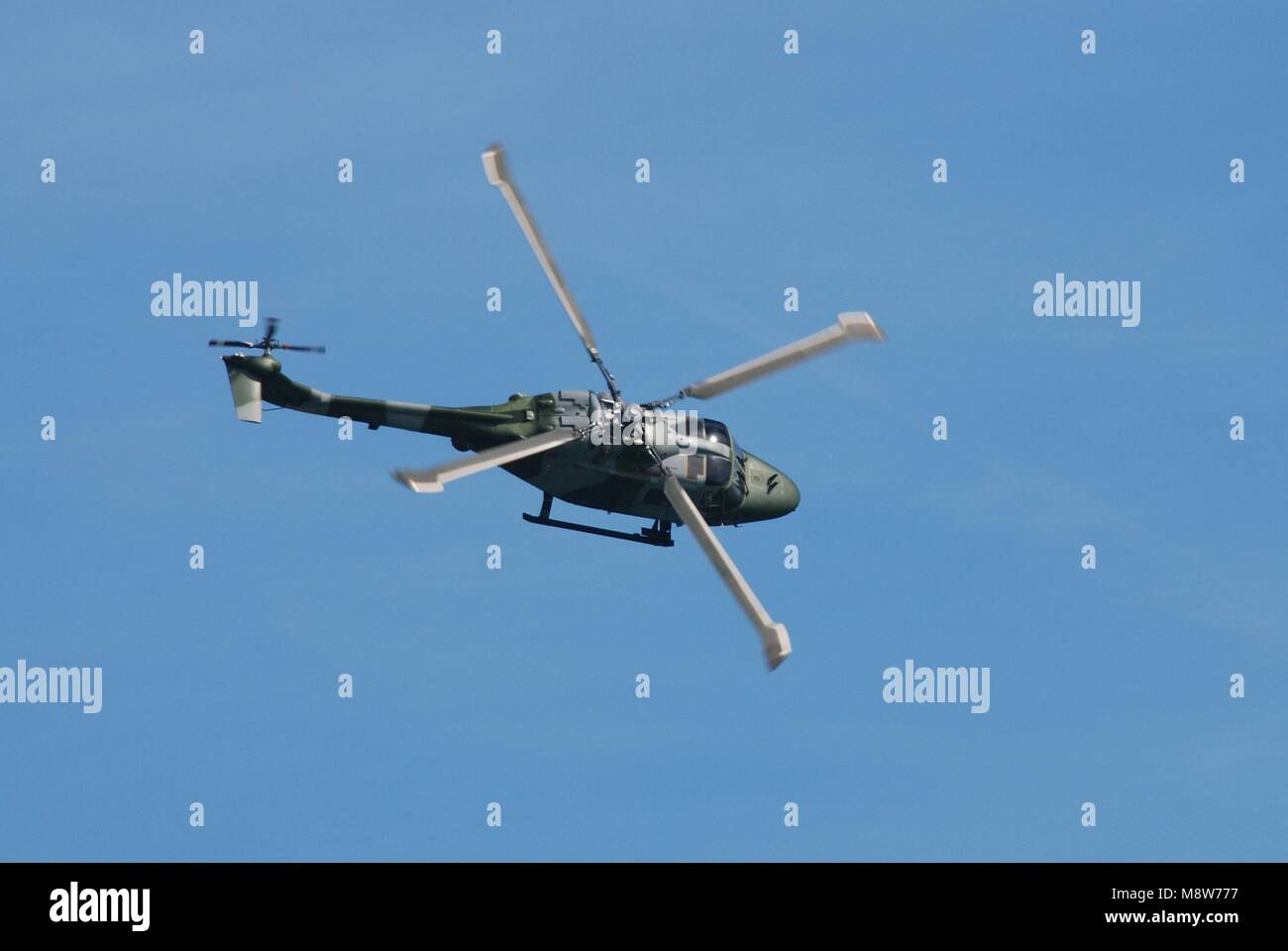 A Westland Lynx AH.7 helicopter of the British Army Air Corps (AAC) performs at the Airbourne airshow at Eastbourne, England on August 11, 2012. Stock Photo