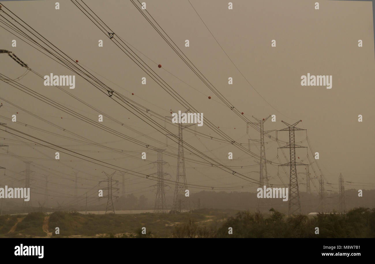 Sand Storm in Israel. Power Lines and Electricity Pylons Low