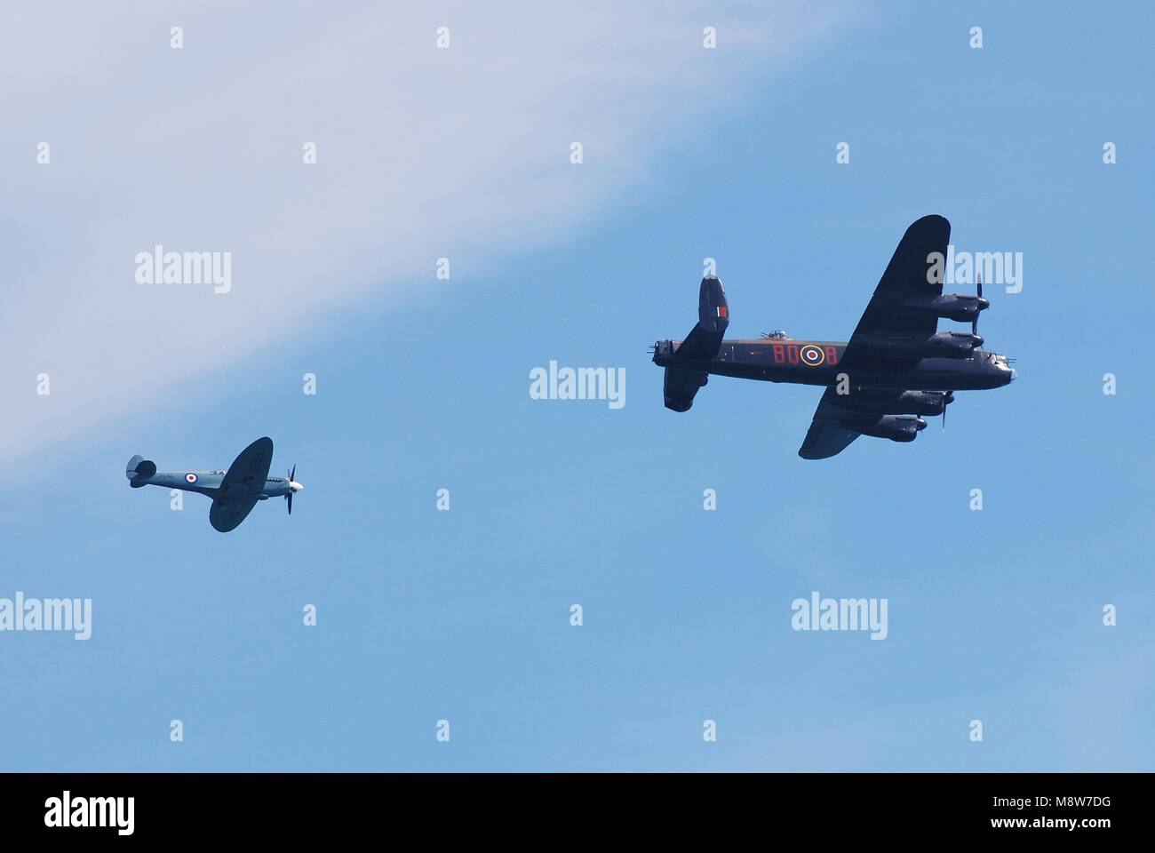 Avro Lancaster PA474 of the Battle of Britain Memorial Flight and Spitfire escort perform at the Airbourne airshow at Eastbourne on August 11, 2012. Stock Photo