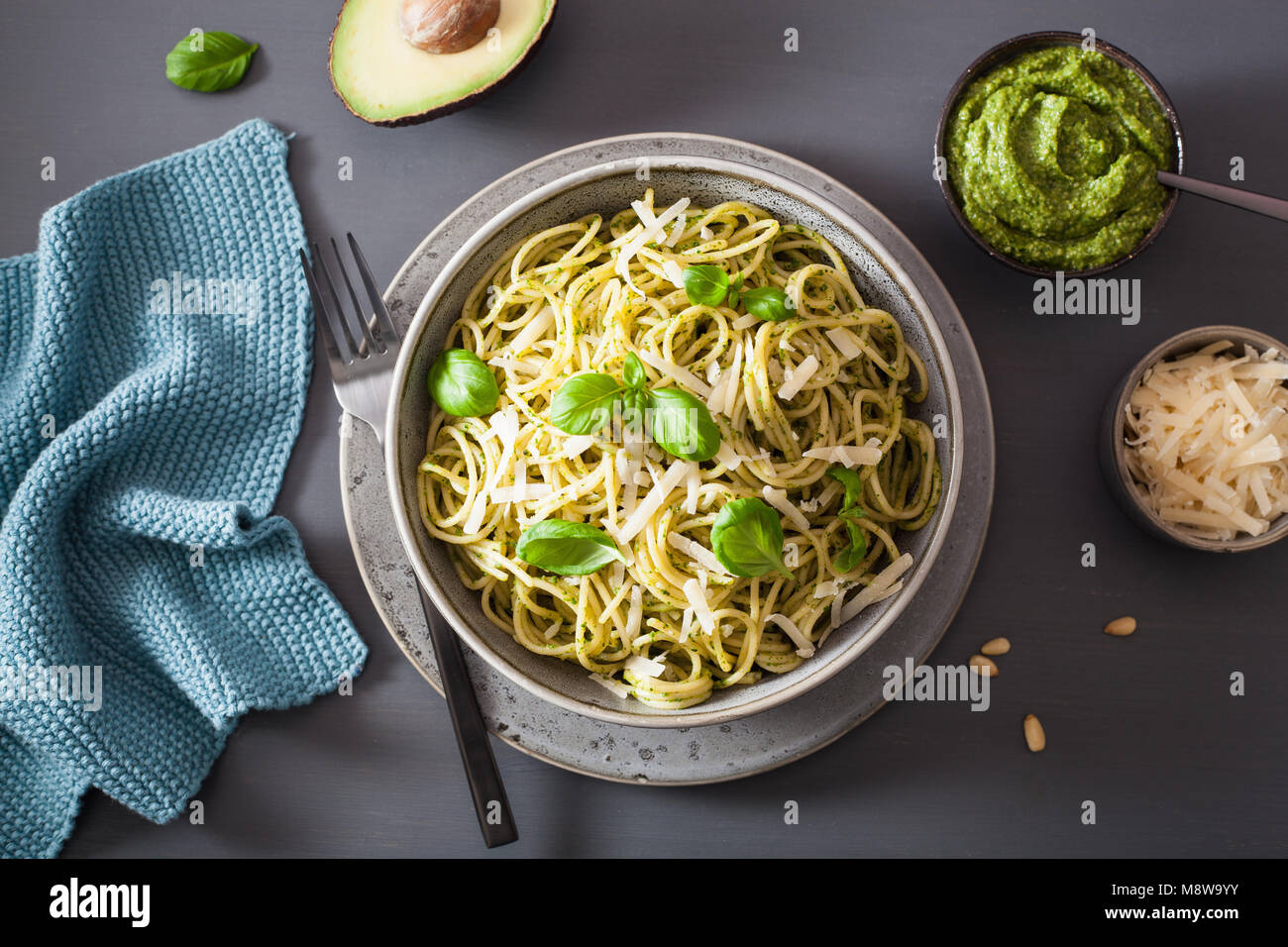 spaghetti pasta with avocado basil pesto sauce Stock Photo